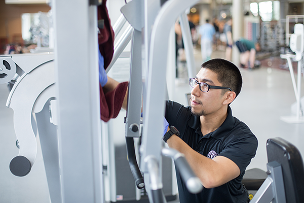 urec student staff cleans equipment